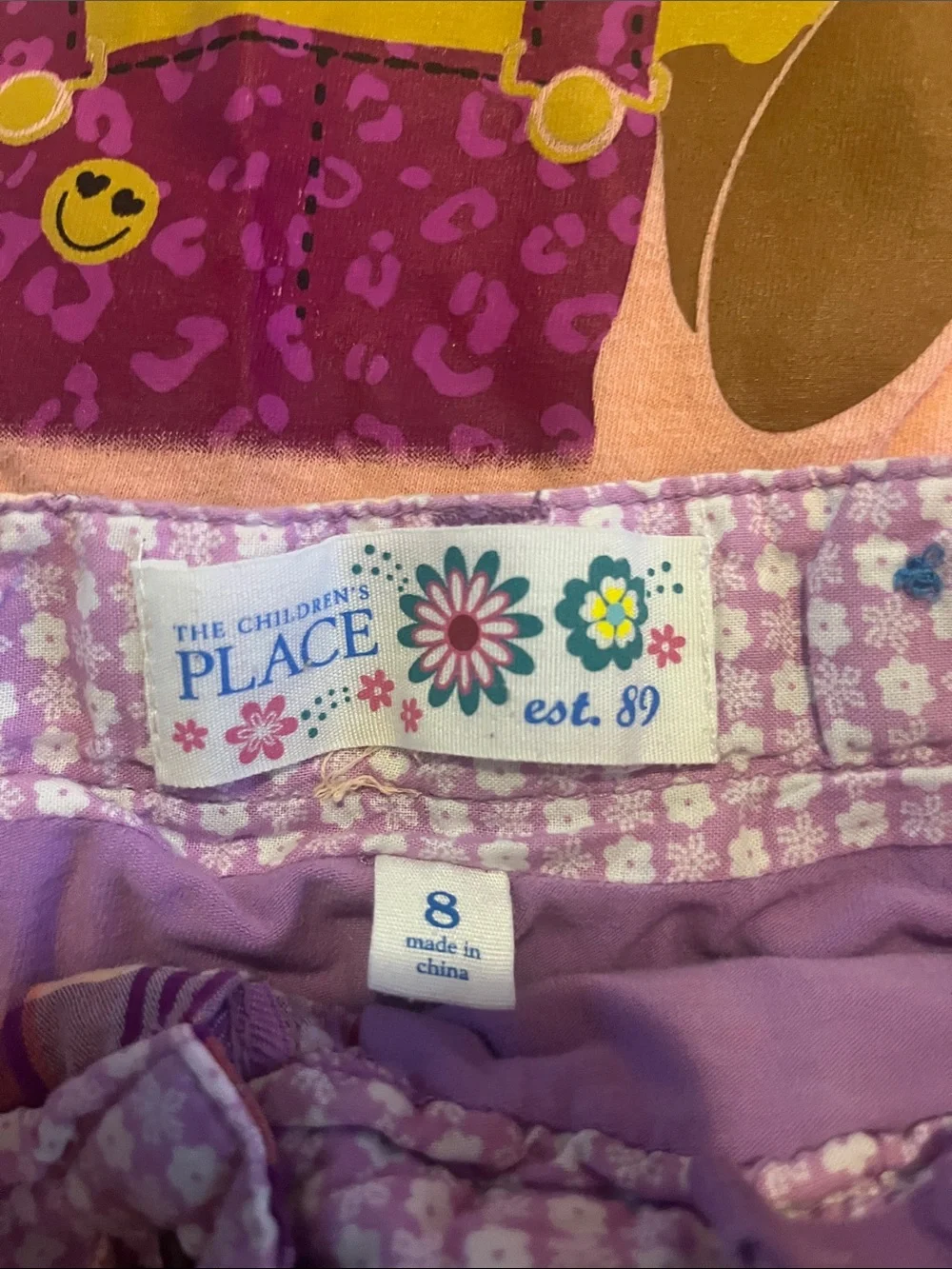 Place Peach Graphic Tee with Purple & Orange Plaid Ruffle Skirt